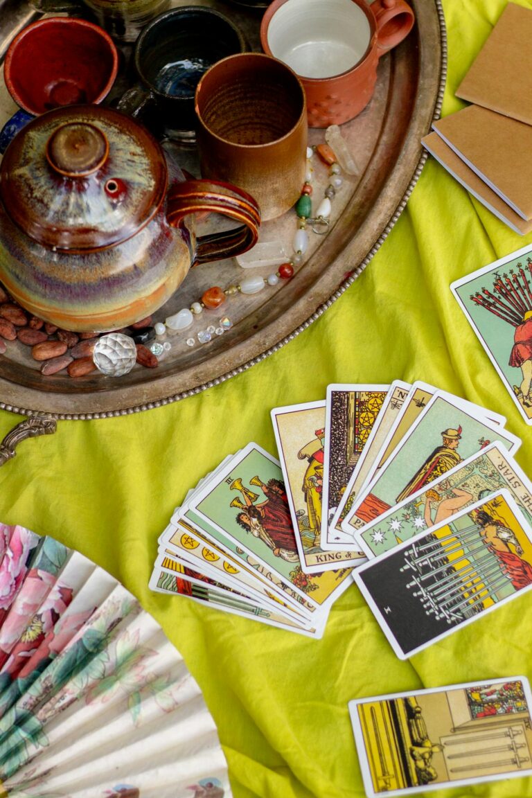 Vibrant setup for a tarot reading session with tea and spiritual items.